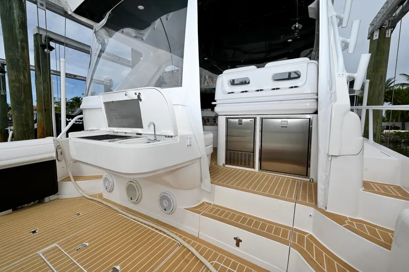  Yacht Photos Pics 2019 Intrepid 475 Sport Yacht deck with grill and stainless steel appliances.