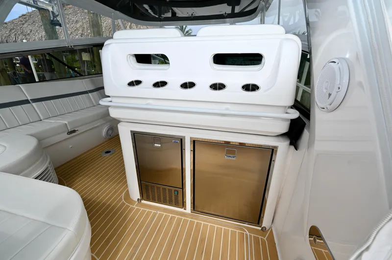  Yacht Photos Pics 2019 Intrepid 475 Sport Yacht interior with seating and built-in appliances.