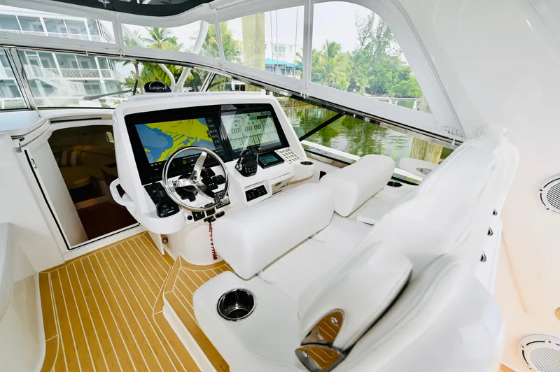  Yacht Photos Pics 2019 Intrepid 475 Sport Yacht cockpit with modern navigation system and luxurious seating.
