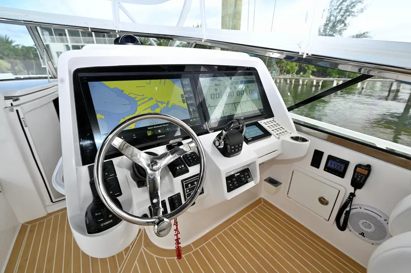  Yacht Photos Pics Helm of 2019 Intrepid 475 Sport Yacht with advanced navigation displays and controls.