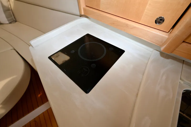  Yacht Photos Pics 2019 Intrepid 475 Sport Yacht interior with sleek induction cooktop.