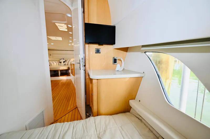  Yacht Photos Pics 2019 Intrepid 475 Sport Yacht interior with cozy cabin, TV, and modern design.