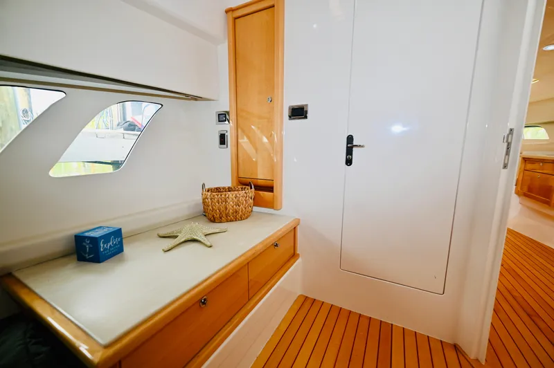  Yacht Photos Pics 2019 Intrepid 475 Sport Yacht interior with wooden accents and nautical decor.