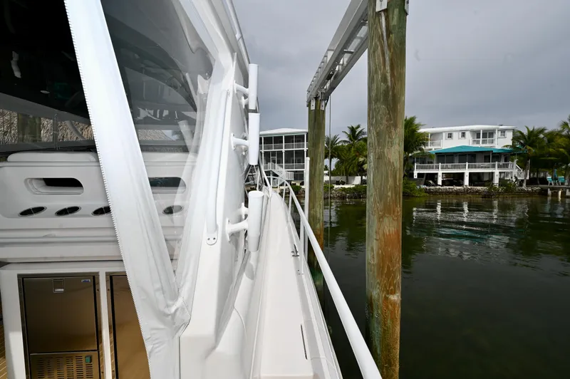  Yacht Photos Pics 2019 Intrepid 475 Sport Yacht docked near waterfront homes.