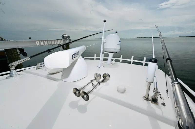  Yacht Photos Pics 2019 Intrepid 475 Sport Yacht deck with navigation equipment and ocean view.