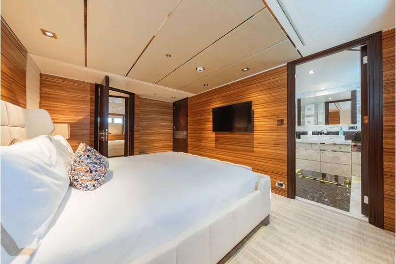 Superyacht W Yacht Photos Pics Luxurious bedroom on 2013 Feadship motor yacht with modern wood paneling and ensuite bathroom.