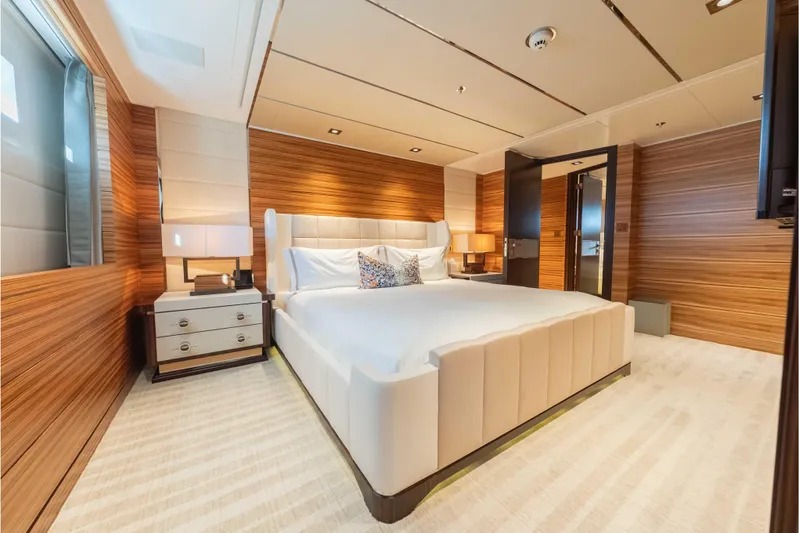 Superyacht W Yacht Photos Pics Luxurious bedroom interior on 2013 Feadship motor yacht, featuring elegant wood paneling and modern design.