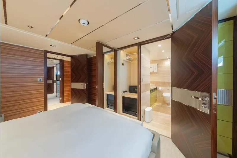 Superyacht W Yacht Photos Pics Luxurious 2013 Feadship motor yacht bedroom with ensuite bathroom, featuring elegant wood paneling.