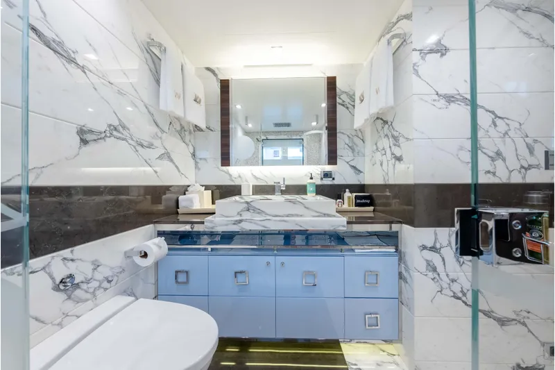 Superyacht W Yacht Photos Pics Luxurious marble bathroom in 2013 Feadship motor yacht, featuring elegant fixtures and modern design.