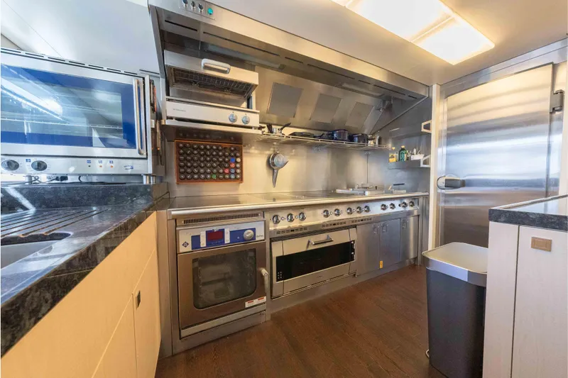 Superyacht W Yacht Photos Pics Modern kitchen in a 2013 Feadship motor yacht with stainless steel appliances and sleek design.