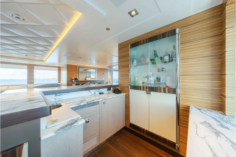 Superyacht W Yacht Photos Pics Luxurious interior of 2013 Feadship motor yacht with modern bar and elegant wood finishes.