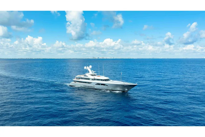 Superyacht W Yacht Photos Pics Luxurious 2013 Feadship motor yacht cruising on open blue sea under clear skies.
