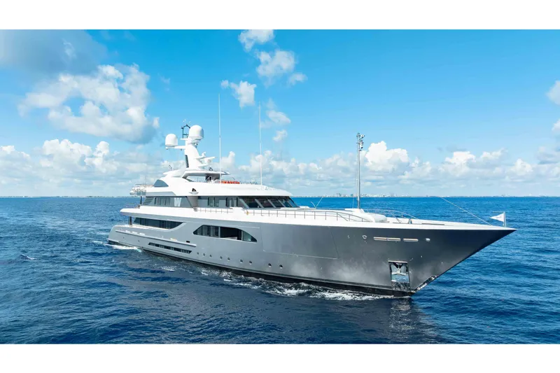 Superyacht W Yacht Photos Pics Luxurious 2013 Feadship motor yacht cruising on open sea under clear blue sky.