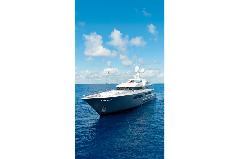 Superyacht W Yacht Photos Pics Luxurious 2013 Feadship motor yacht cruising on open blue sea under clear sky.