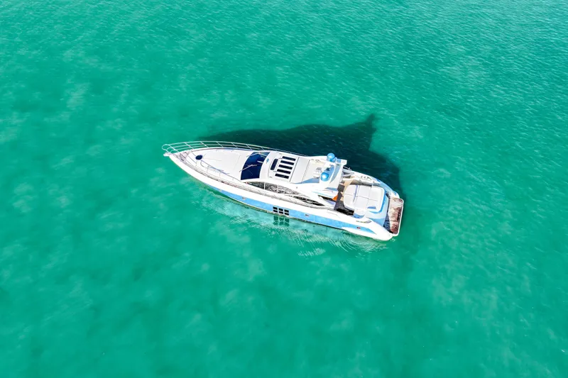  Yacht Photos Pics Aerial view of 2006 Azimut 68S yacht on turquoise water.