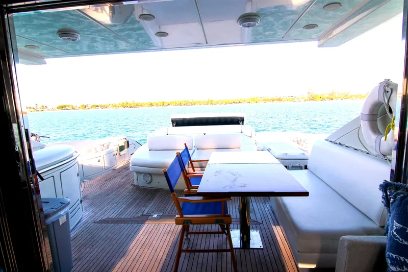  Yacht Photos Pics Luxury Azimut 68S yacht deck with seating, table, and ocean view, 2006 model.