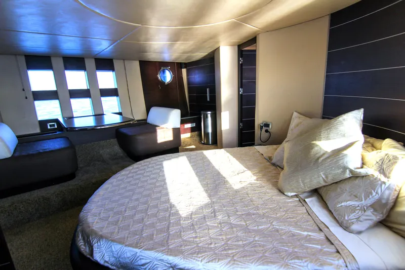  Yacht Photos Pics Luxurious interior of 2006 Azimut 68S yacht with elegant bedroom and ocean view.