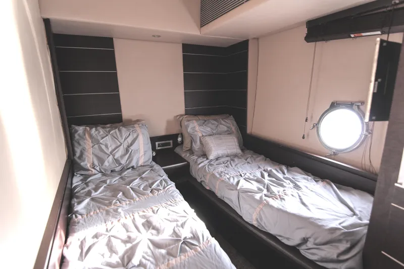  Yacht Photos Pics Twin cabin interior of 2006 Azimut 68S yacht with porthole window.