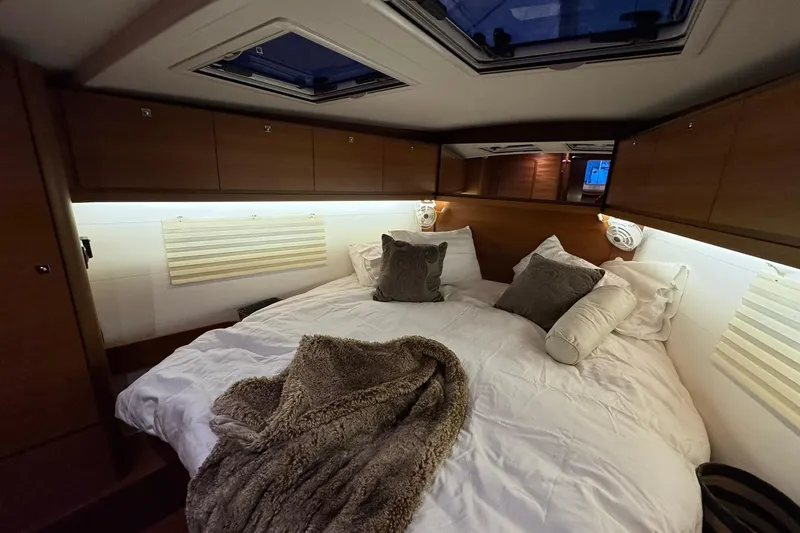 Nine Yacht Photos Pics Luxurious cabin interior of 2016 Dufour 512 Grand Large yacht with cozy bedding.