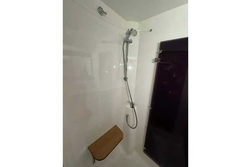 Nine Yacht Photos Pics Shower area in 2016 Dufour 512 Grand Large yacht with wooden seat.