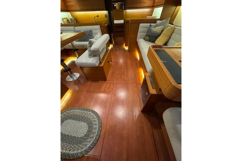 Nine Yacht Photos Pics Luxurious interior of 2016 Dufour 512 Grand Large yacht with elegant wood finish.