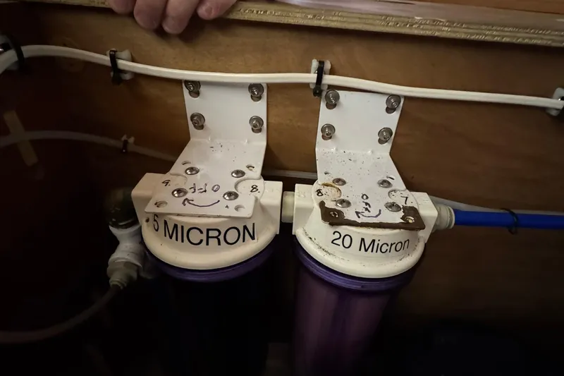 Nine Yacht Photos Pics Water filtration system on a 2016 Dufour 512 Grand Large yacht, featuring 5 and 20 micron filters.