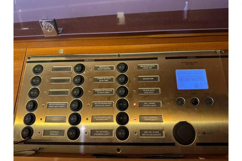 Nine Yacht Photos Pics Control panel of a 2016 Dufour 512 Grand Large yacht, featuring various service switches.