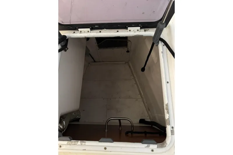 Nine Yacht Photos Pics Hatch interior of 2016 Dufour 512 Grand Large sailboat, showing storage space.