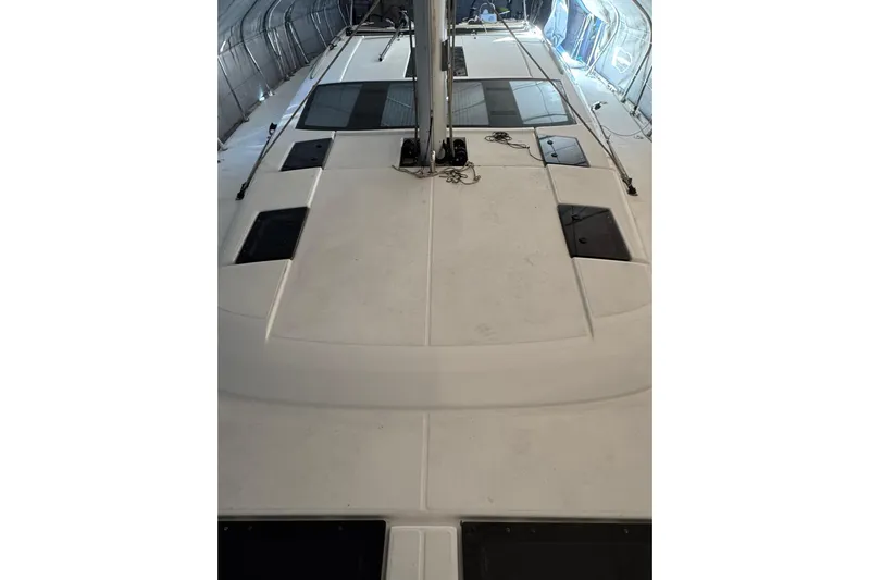 Nine Yacht Photos Pics 2016 Dufour 512 Grand Large yacht deck under cover, showcasing sleek design.