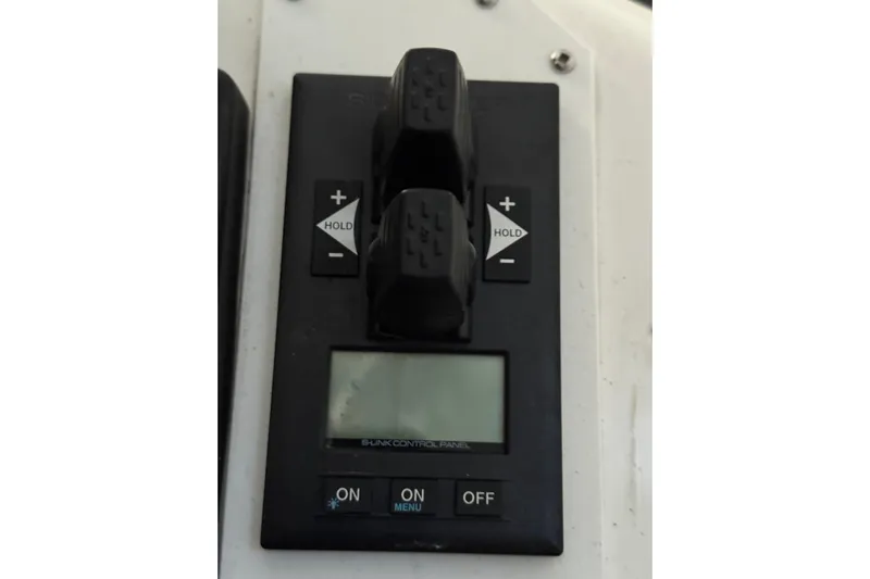 Nine Yacht Photos Pics Control panel of a 2016 Dufour 512 Grand Large yacht with display and buttons.