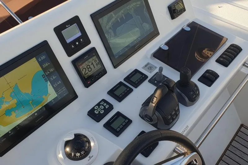 Amarsi Yacht Photos Pics Control panel of 2023 Prestige 520 yacht with navigation and monitoring systems.