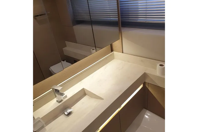 Amarsi Yacht Photos Pics Modern bathroom interior on a 2023 Prestige 520 yacht, featuring sleek fixtures and minimalist design.