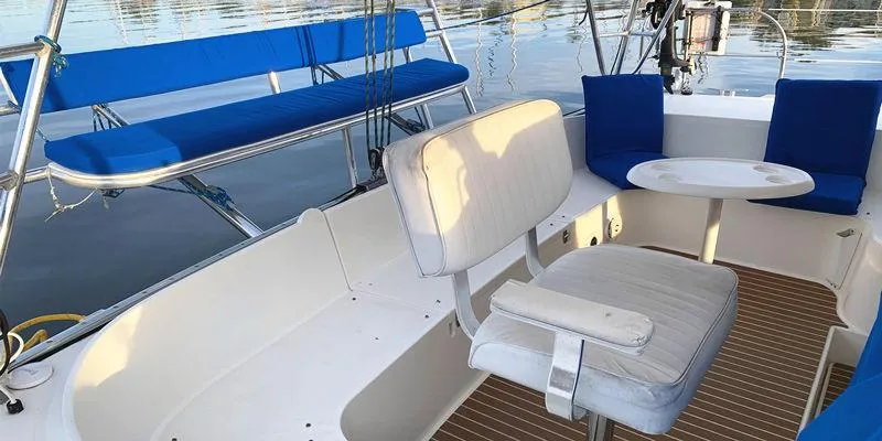 Aha Yacht Photos Pics 1997 Fountaine Pajot Tobago 35 yacht interior with blue and white seating.