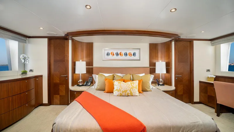 Sea N Sea Yacht Photos Pics Luxurious bedroom interior on 2016 Ocean Alexander Skylounge yacht, featuring elegant wood finishes.