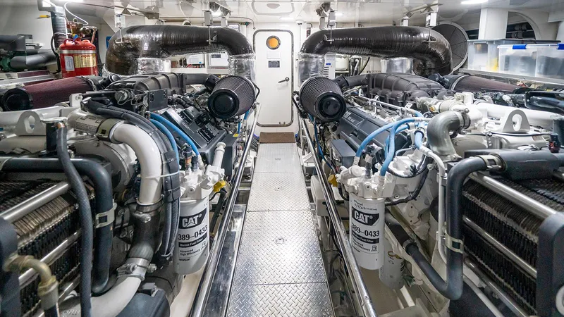 Sea N Sea Yacht Photos Pics Engine room of 2016 Ocean Alexander Skylounge yacht, featuring dual CAT engines and equipment.