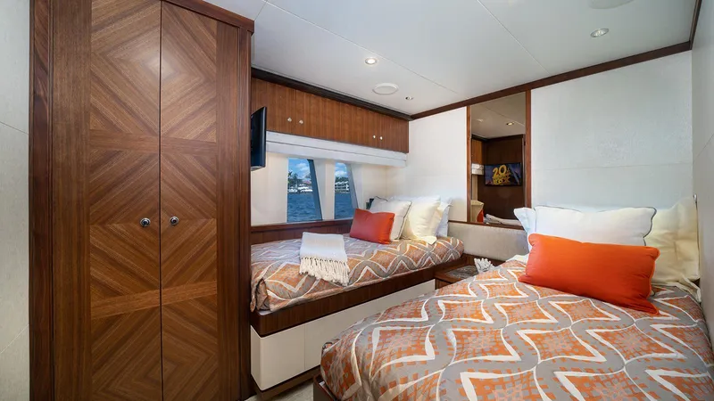 Sea N Sea Yacht Photos Pics Luxurious 2016 Ocean Alexander Skylounge bedroom with twin beds, wooden cabinetry, and ocean view.