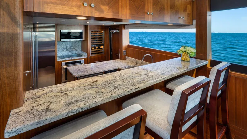 Sea N Sea Yacht Photos Pics Luxurious 2016 Ocean Alexander Skylounge yacht kitchen with granite countertops and ocean view.