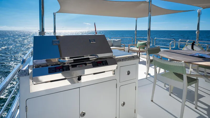 Sea N Sea Yacht Photos Pics Luxurious 2016 Ocean Alexander Skylounge yacht deck with grill and ocean view.