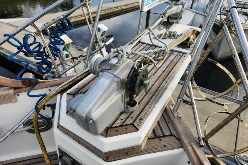 Part Of The Plan Yacht Photos Pics Windlass on 1990 Grand Banks 46 Classic yacht deck, docked at marina.