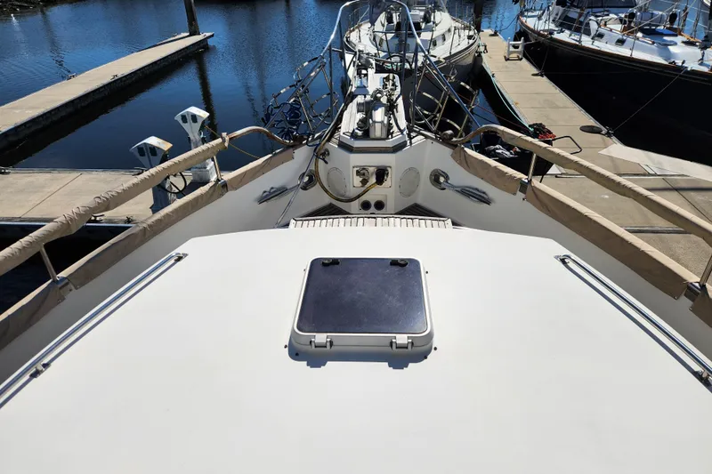 Part Of The Plan Yacht Photos Pics 1990 Grand Banks 46 Classic yacht docked at marina, view from deck.