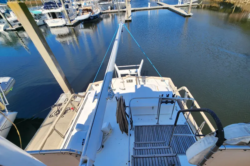 Part Of The Plan Yacht Photos Pics 1990 Grand Banks 46 Classic yacht docked at marina, view from deck.