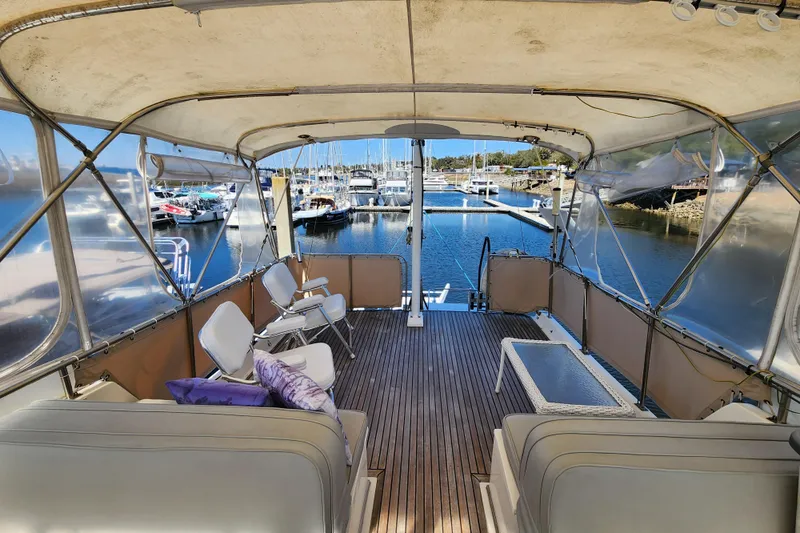 Part Of The Plan Yacht Photos Pics Spacious deck of 1990 Grand Banks 46 Classic yacht in marina setting.