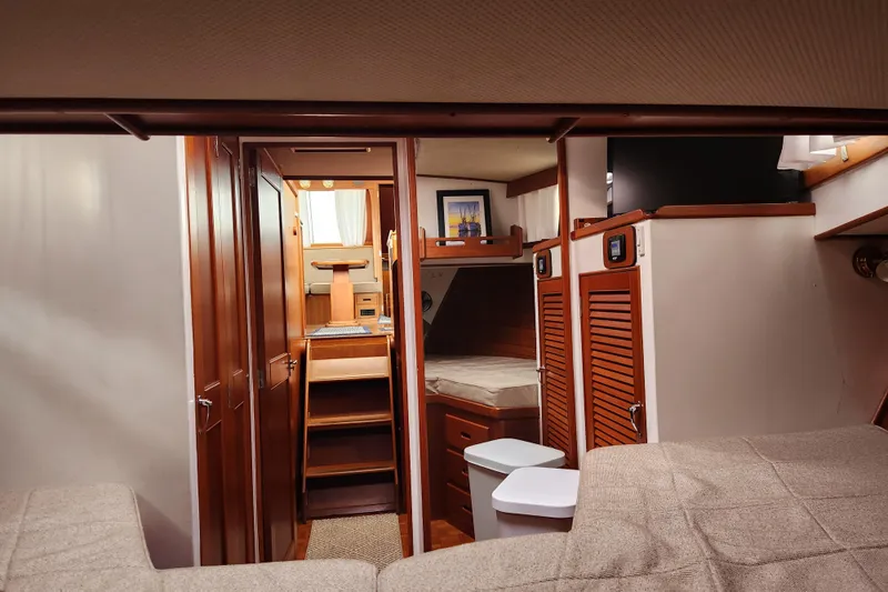 Part Of The Plan Yacht Photos Pics Interior of 1990 Grand Banks 46 Classic yacht with cozy wooden furnishings.