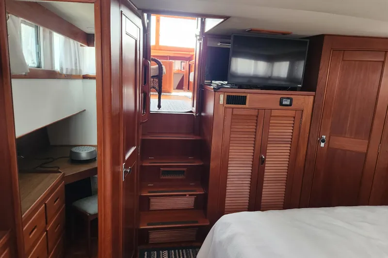 Part Of The Plan Yacht Photos Pics Interior of 1990 Grand Banks 46 Classic yacht with wooden cabinetry and modern amenities.