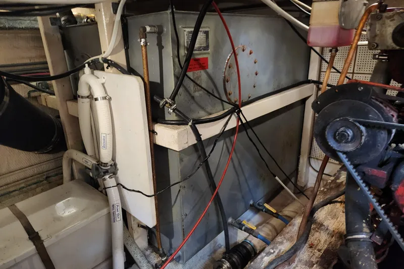 Part Of The Plan Yacht Photos Pics Engine room of a 1990 Grand Banks 46 Classic yacht, showing machinery and wiring.