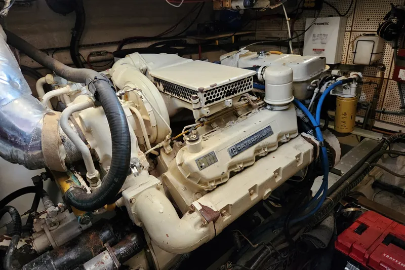 Part Of The Plan Yacht Photos Pics Engine room of 1990 Grand Banks 46 Classic with Caterpillar engine.