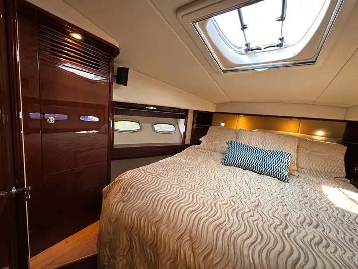 Mia Yacht Photos Pics Luxurious cabin interior of 2009 Sea Ray 60 Sundancer yacht with skylight and plush bedding.