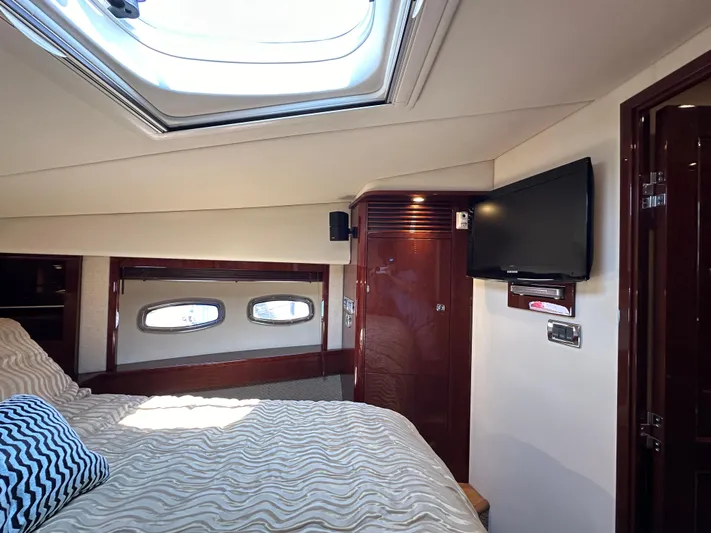 Mia Yacht Photos Pics Luxurious cabin interior of 2009 Sea Ray 60 Sundancer yacht with skylight and TV.