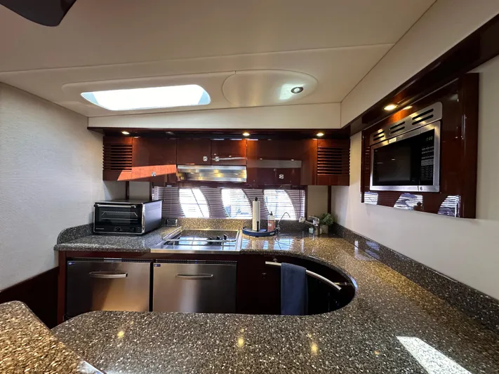 Mia Yacht Photos Pics Luxurious kitchen interior of 2009 Sea Ray 60 Sundancer yacht with modern appliances.