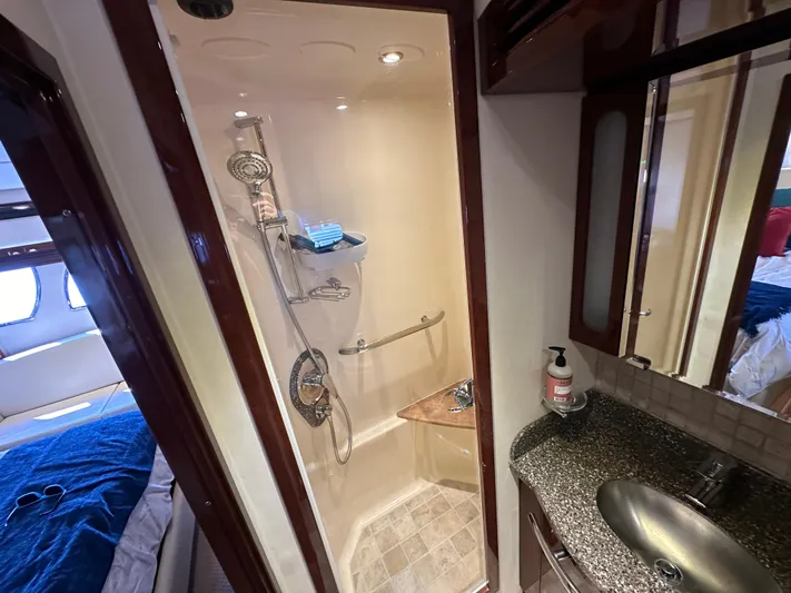 Mia Yacht Photos Pics Luxurious bathroom in 2009 Sea Ray 60 Sundancer yacht with modern shower and sleek sink.